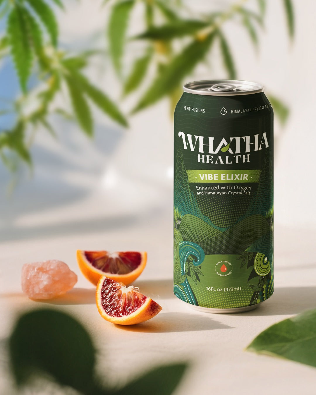 Can of 'WHATHA HEALTH' drink with fruits on a light surface