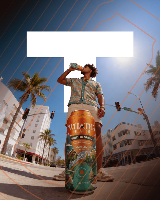 Person drinking from a can on a city street with palm trees and buildings in the background Whatha Health